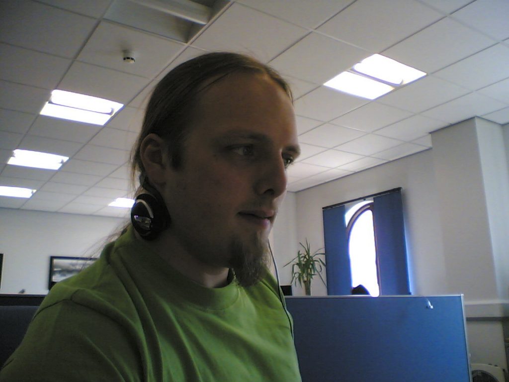 Dan at work, listening to Pink Floyd and hammering out code