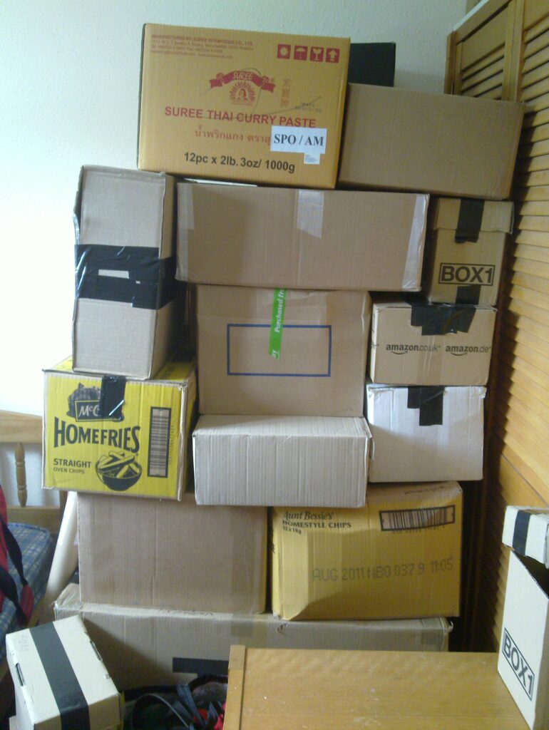 Paul's room here on Earth looks just like his flat in Aberystwyth used to: full of boxes!