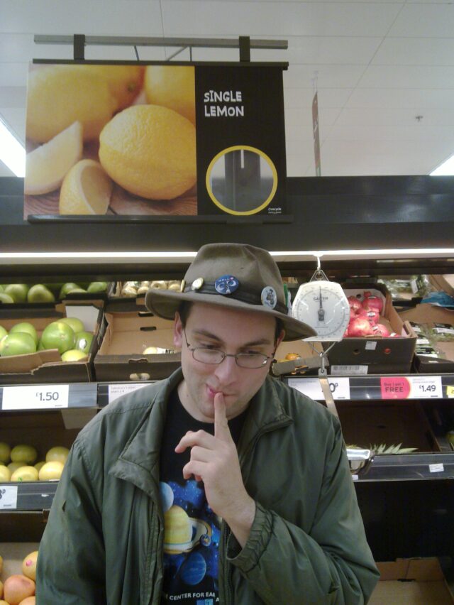 Paul - Single Lemon Paul in a supermarket under a sign that reads "Single Lemons".