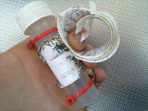 Geocache with hard drive magnet as an attachment point.