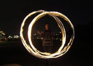 Fire poi! They look fantastic when they're flying around you; scary when they're flying towards you.