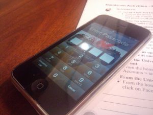 iPhone showing the PIN lock screen.