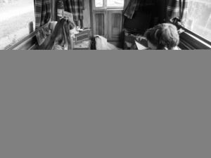 Ruth and JTA set up Arkham Horror in the narrowboat.