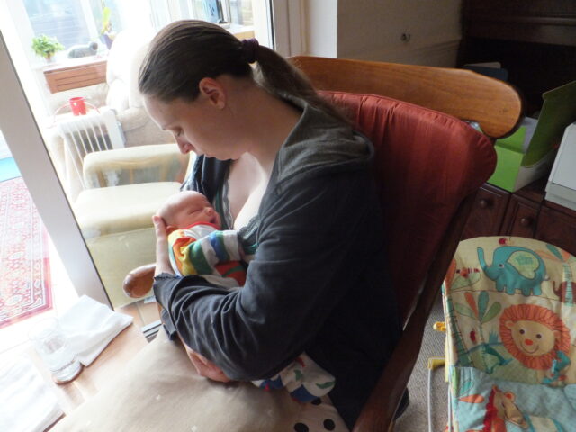 Ruth snuggles with her baby.