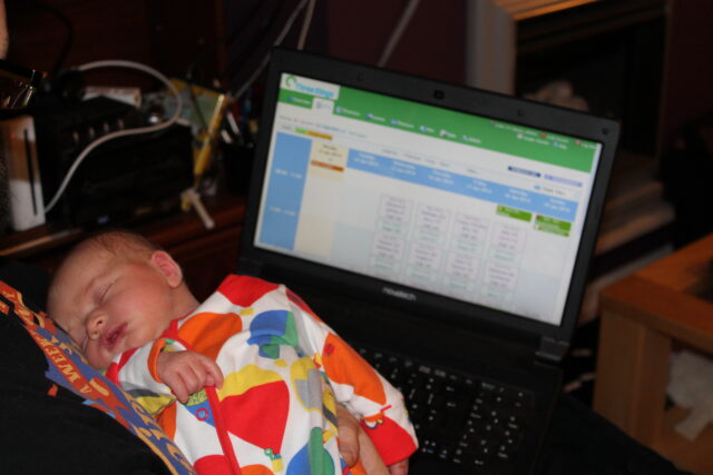 Tiny in front of the new beta version of Three Rings.