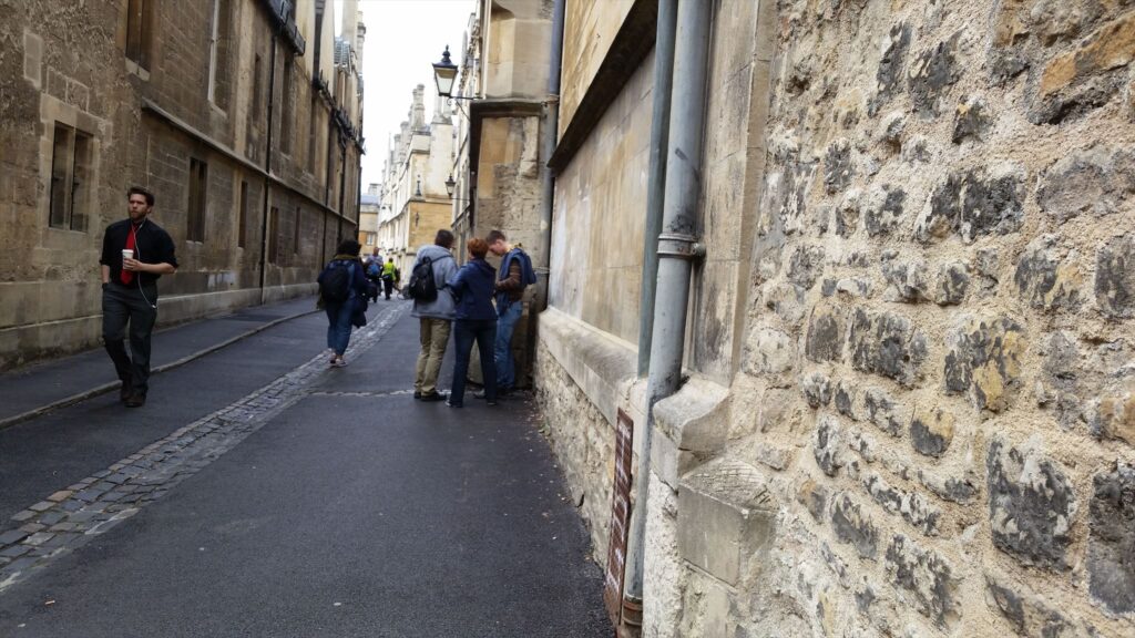 Suspected-geocachers in Brasenose Lane.