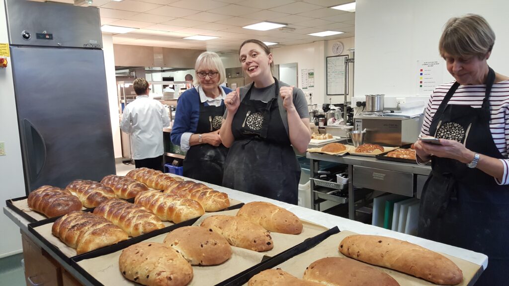 Ruth among the challah, stollen, and wreaths.