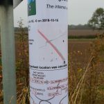 Geohashing sign attached to a convenient sign post.