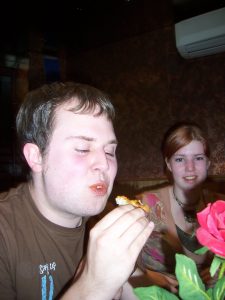 Andy eats some pizza