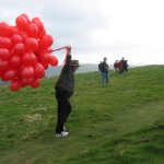 Paul struggles to bring the balloons to the very top
