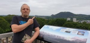 Dan points to Edinburgh Castle in the distance