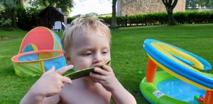 John eats watermelon.