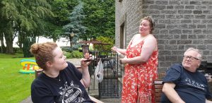 Becky pops fizz for Jemma.