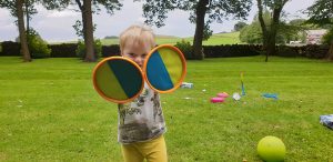 John wears velcro mitts.