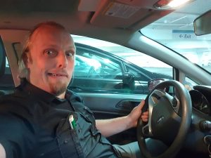 Dan tries to comprehend driving on the wrong side of the car