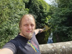 Dan pointing down a canal.