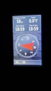 GPS receiver showing 58 metres to a destination to the East.