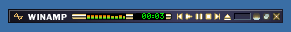 WinAmp music player in minified mode: just a sliver of a music player, small, showing just back/forward/play/pause/stop controls, play time, and a mini-equaliser. The timer shows we're 3 seconds into a track.