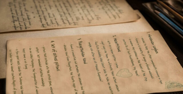 Pile of old papers with handwritten notes, including ingredients for a high fantasy "dream machine".