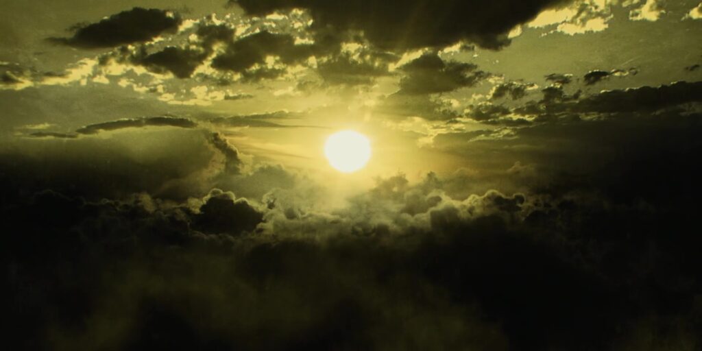 Sun shining through yellow clouds.