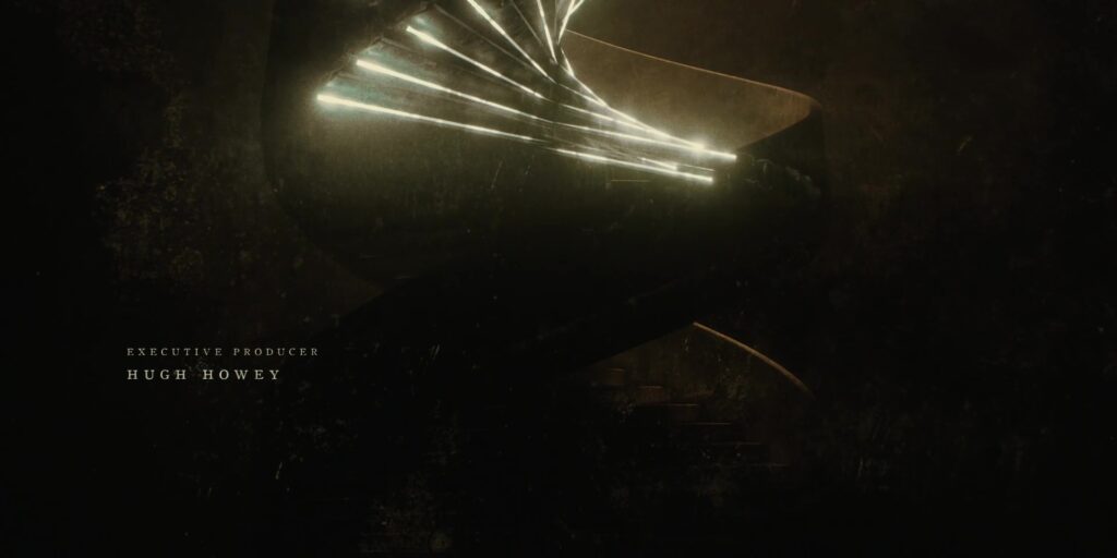 A spiral staircase becomes encased in outlines of blue-white light.