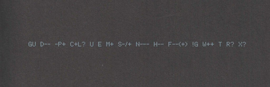 A "Geek Code Block", printed in a dot-matrix style font, light-blue on black, reads: GU D-- -P+ C+L? U E M+ S-/+ N--- H-- F--(+) !G W++ T R? X?