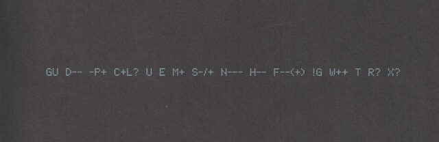 A "Geek Code Block", printed in a dot-matrix style font, light-blue on black, reads: GU D-- -P+ C+L? U E M+ S-/+ N--- H-- F--(+) !G W++ T R? X?