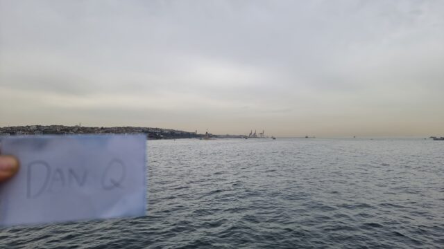 The same tower, but now with 'Dan Q' held on a piece of paper in front of it.