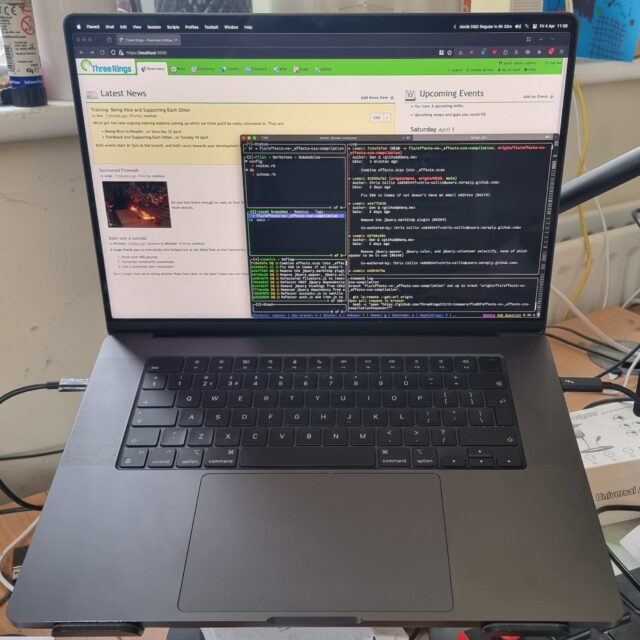 Black Macbook Pro whose screen shows a locally-hosted copy of the Three Rings web application, overlaid with a terminal running lazygit.