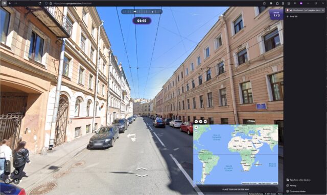 City street shown in GeoGuessr, with white and cream buildings, under a bright blue sky. 1 minute 45 seconds remains to place a pin.