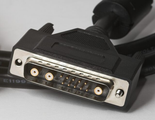 Cable with 'male' DB13W3 connector, featuring a D-sub body containing three analogue RGB connectors but with a gap between the second and third into which 10 regular D-sub style pins have been sandwiched in two rows of five).