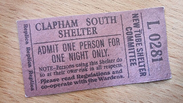 Small pink replica ticket reading 'Clapham South Shelter: Admit One Person for One Night Only', ticket number L0281.
