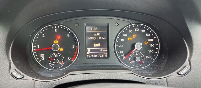 A car dashboard with five amber and one red warning lights lit.