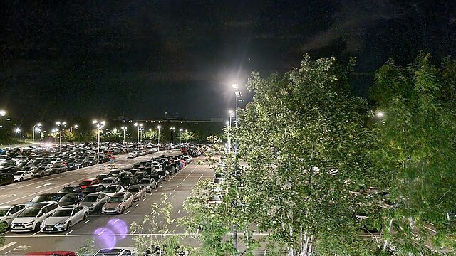 A car park at night.