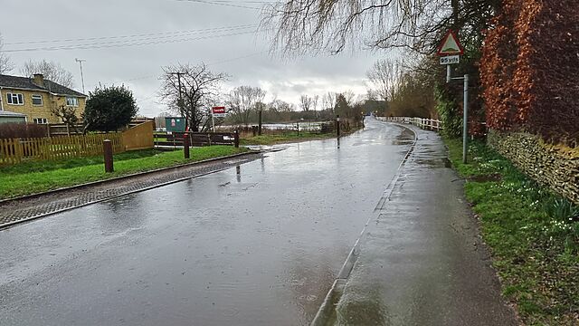 A flooded rural road.