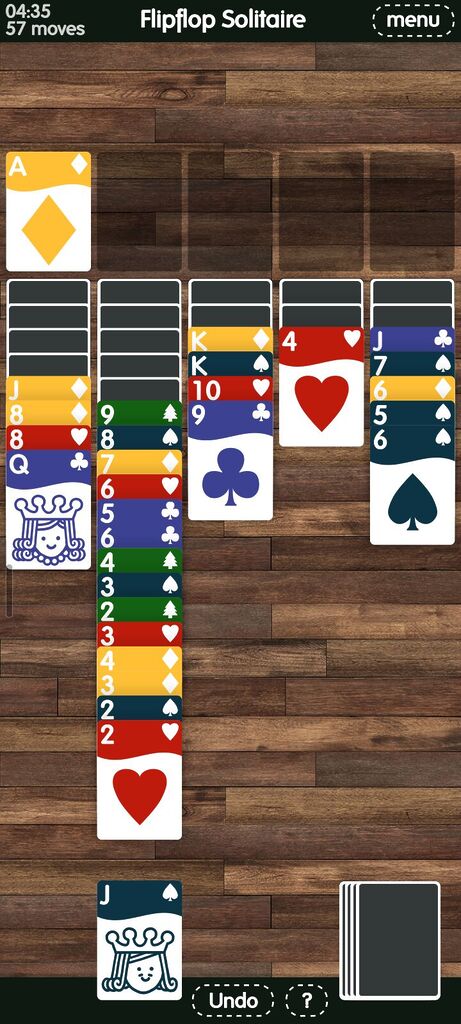 A late game on 5-suit FlipFlop solitaire with many mixed-suit stacks and many face-down cards.