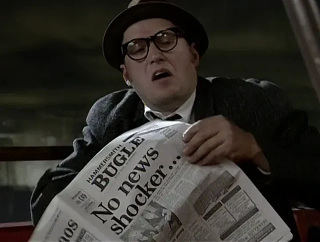 Some pissed old fart reading a newspaper called "The Hammersmith Bugle" with the headline "No news shocker..."
