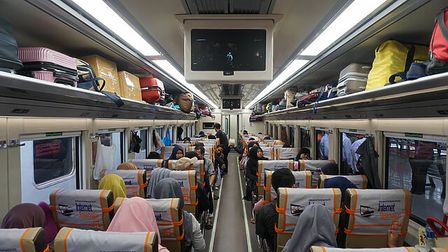 Interior of a busy train carriage.