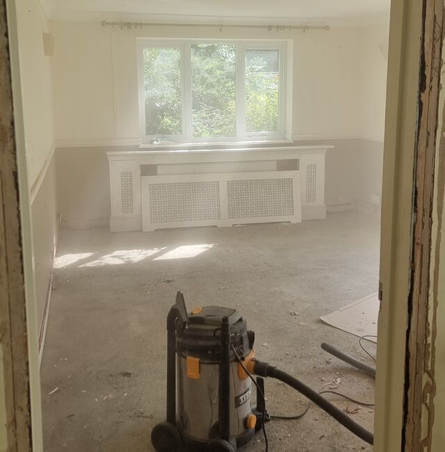A sparse room caked in a cloud of dust.