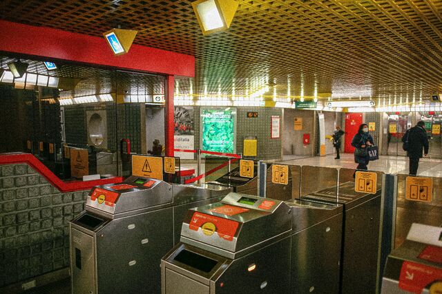 A row of ticket gates in a London Underground station.