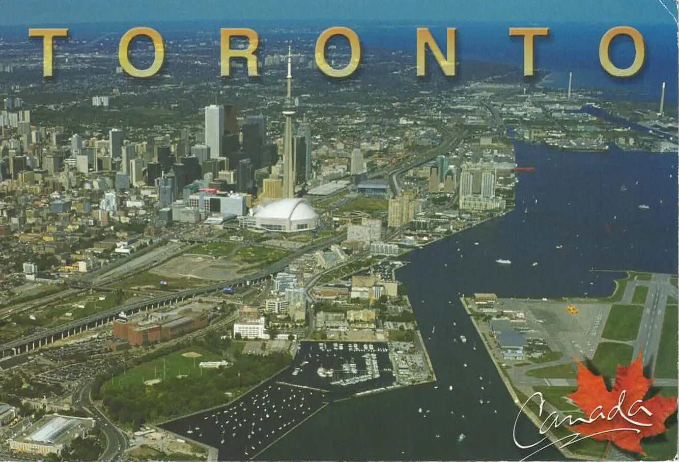 Aerial photograph of Toronto, Canada, featuring Billy Bishop City Airport across from the Ferry Terminal in the foreground, and downtown in the background.