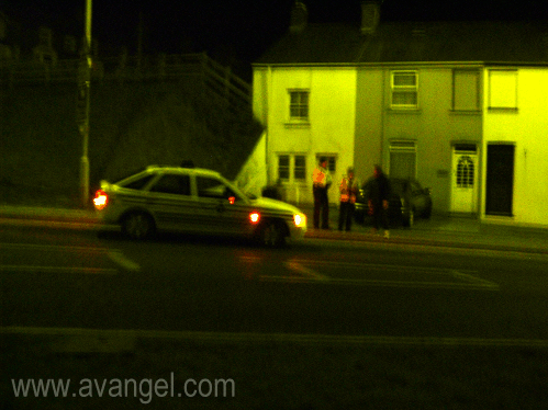 Dan, with an axe, being questioned by the police