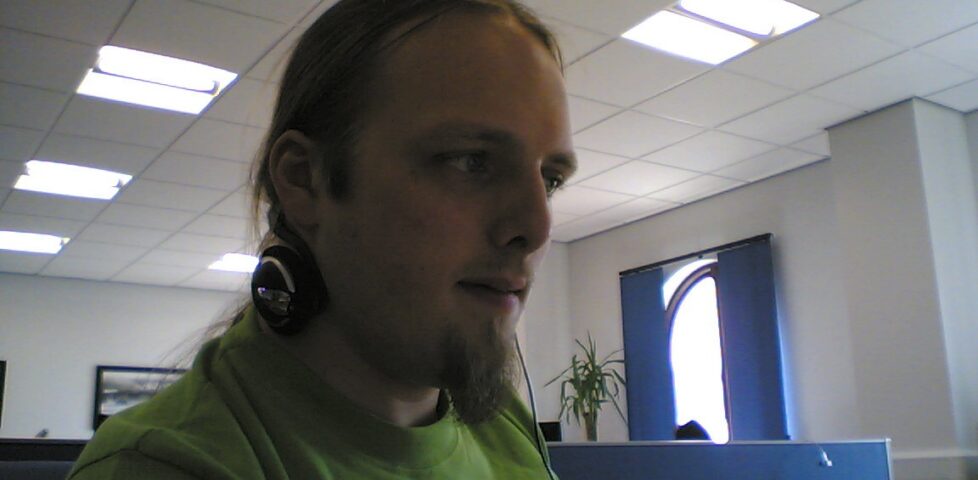 Dan at work, listening to Pink Floyd and hammering out code