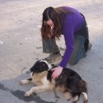 Claire pets a dog
