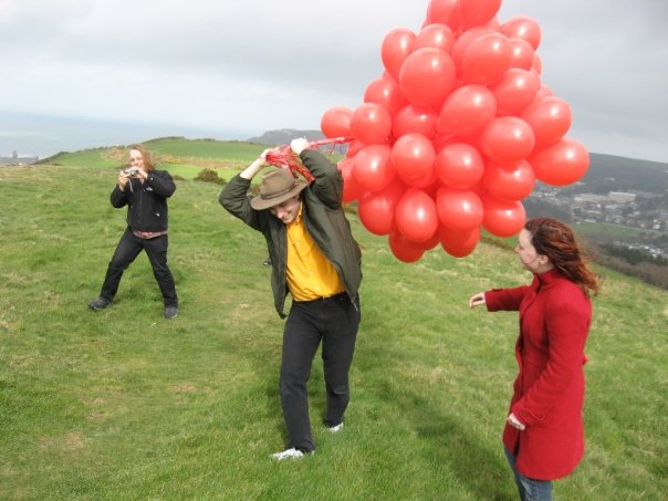 Full image of Claire goes to help Paul with the balloons