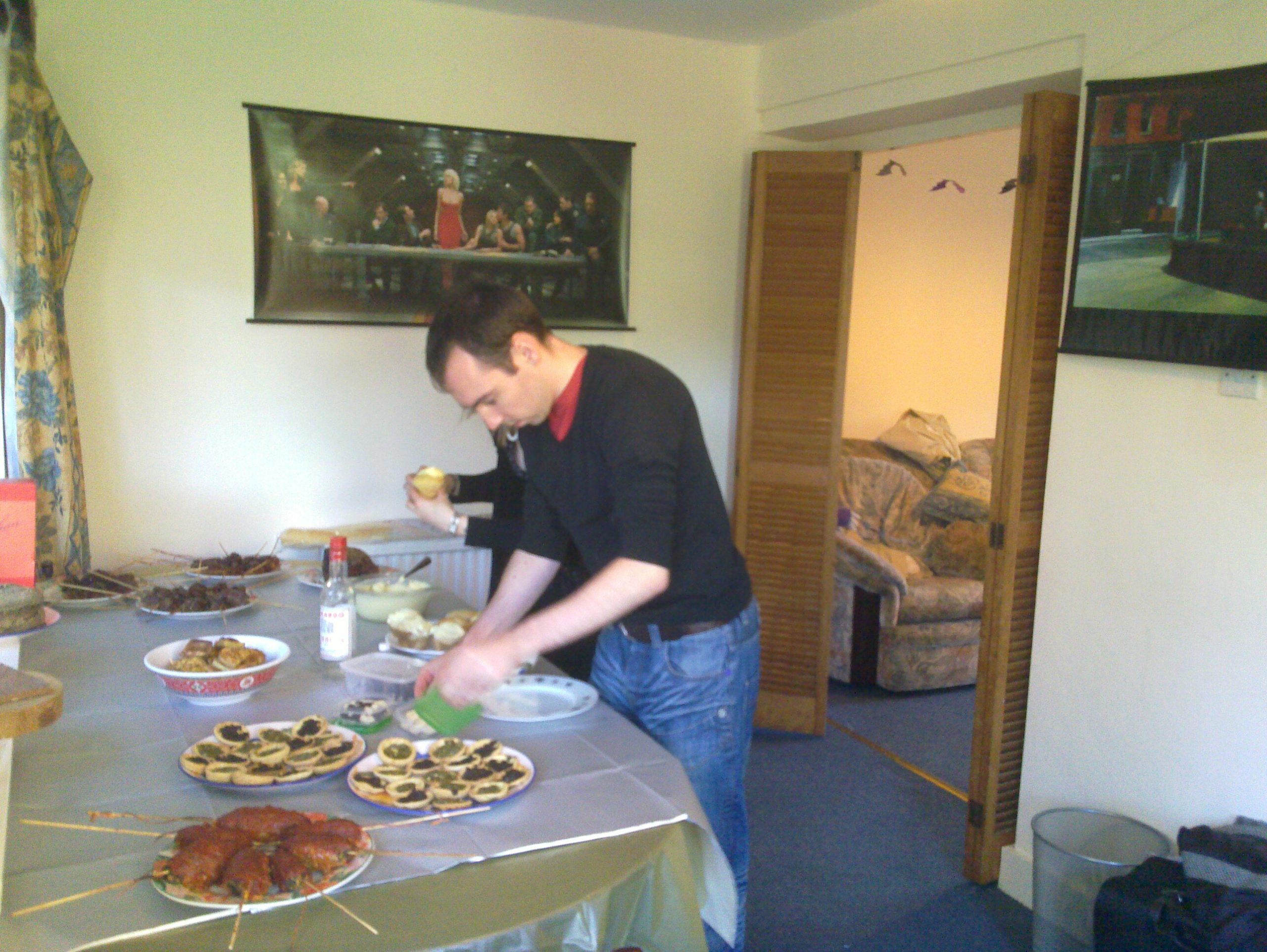 Full image of Simon laying out food.