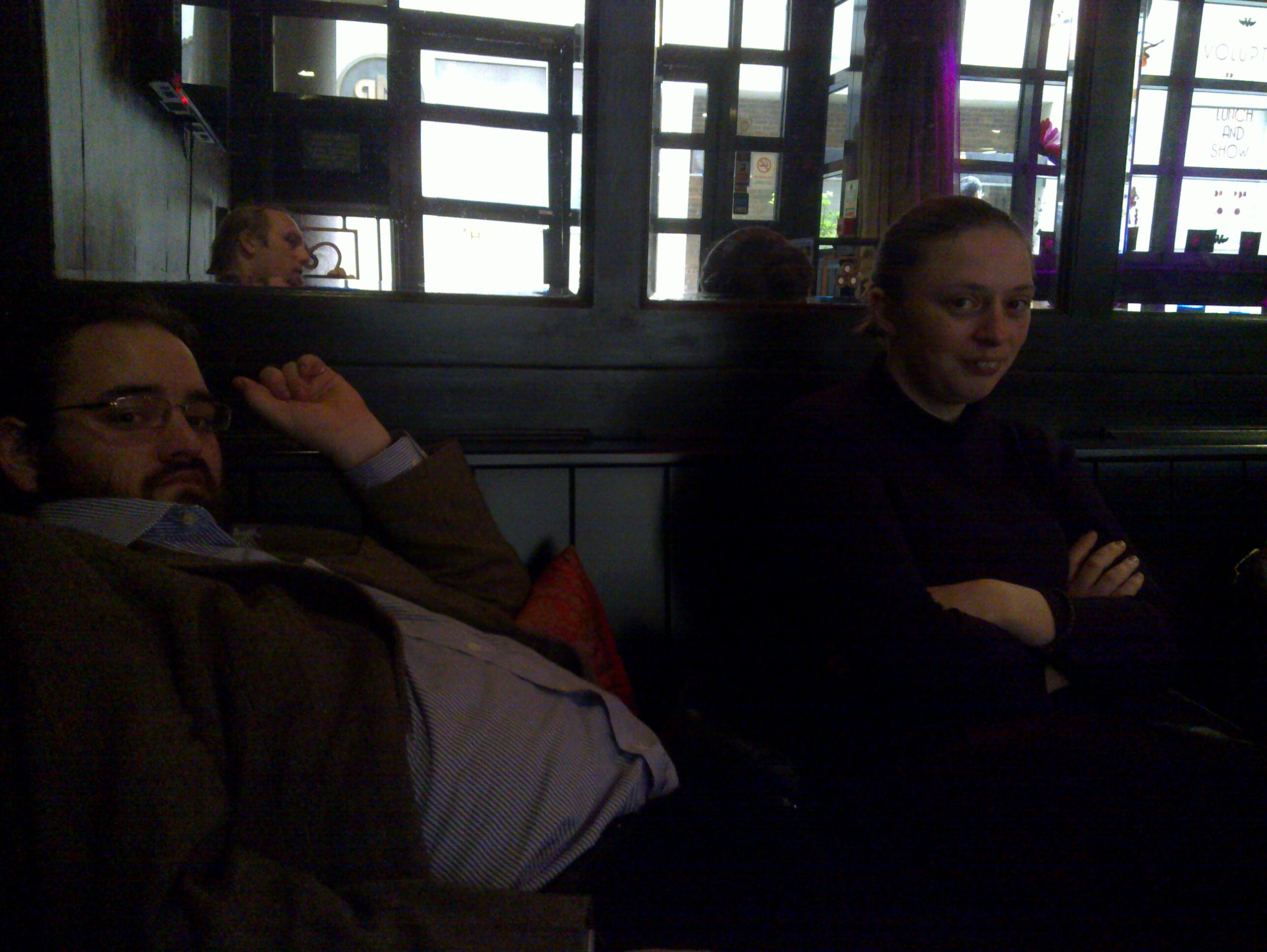 Full image of JTA and Ruth at what we've now decided is our 'usual table' in the cocktail lounge, waiting for Matt to arrive.