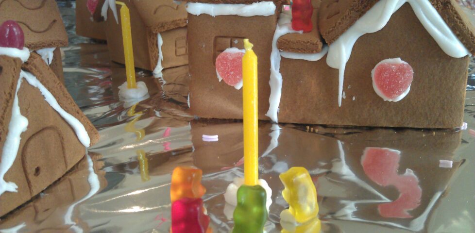Gummy-bear citizens gather around a candle lamp-post in the gingerbread village. Little do they know of the horror that approaches...