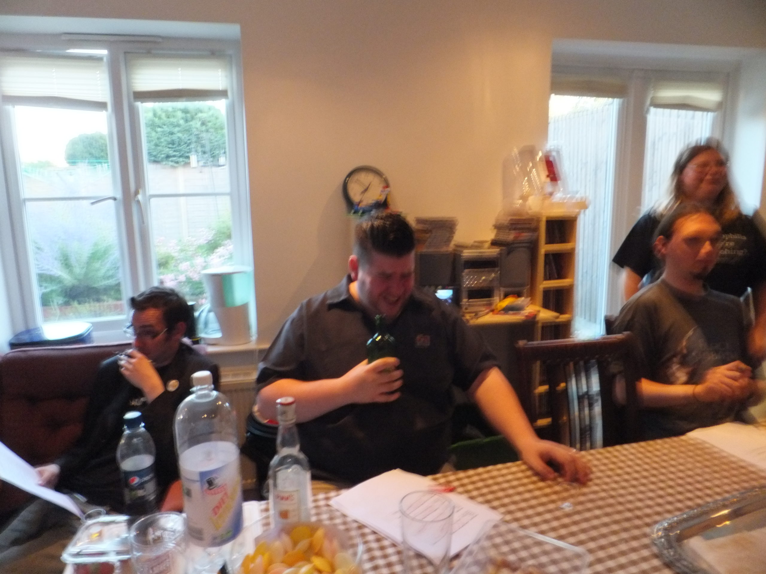 Full image of Everything seems a little blurry, and Alec isn't grimacing as much as he did with some of the other drinks he's been forced to try.