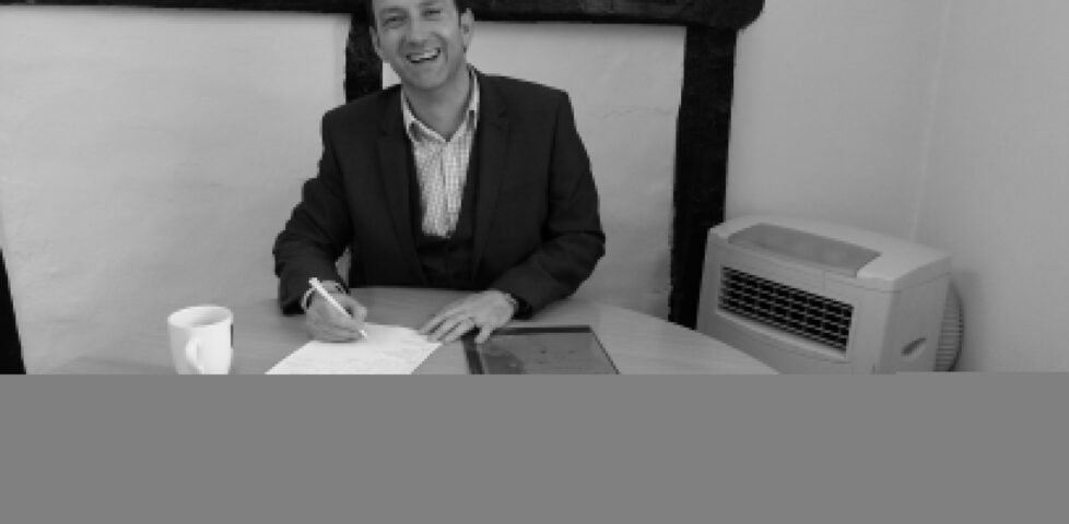 Mortgage broker Stefan Cork amidst our mountains of paperwork.